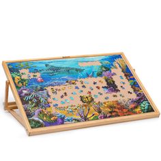 a wooden puzzle with an ocean scene on it