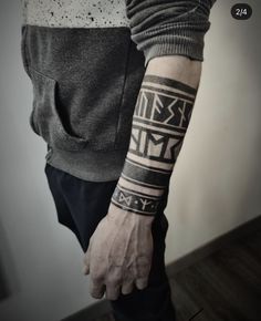 a man with a tattoo on his arm