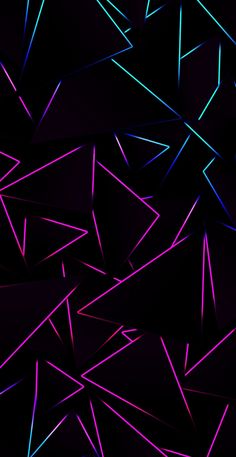 purple and blue triangles are shown in this dark background, with the light shining on them