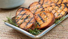 grilled sweet potatoes with herbs on a plate