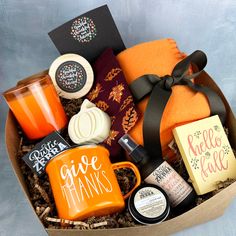 a gift box filled with coffee, tea and goodies for someone's special occasion