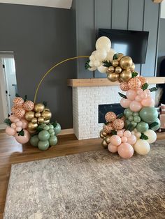 some balloons are on the floor near a fireplace