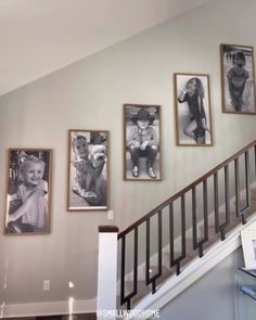 a staircase with pictures hanging on the wall