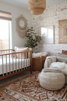 a baby's room with a crib, chair and rug