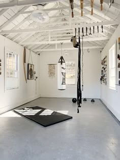 an empty room with various objects hanging from the ceiling