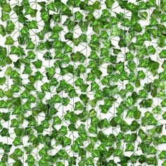 many green leaves are arranged in the shape of an abstract pattern on a white background