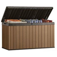 an outdoor storage box with cushions and blankets