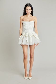 Elevate your style with the Tiara Mini Dress! Crafted with luxurious off-white silk double-faced satin, this dress features a playful mini bow skirt and a delicate corset. Complete your look with the tulle tutu for a touch of elegance and charm. Perfect for any occasion, make a statement with this must-have dress! Satin Mini Skirt, Bow Skirt, Mini Bow, Looks Party, Dream Wedding Ideas Dresses, Tulle Tutu, Mini Robes, Reception Dress, Glam Dresses