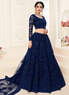 Navy Blue Pearl Embroidered Wedding Lehenga Choli is best pick as an indian wear for festivals or wedding event. This elegant set has a very pretty thread embroidery detailed with zari and pearl work on canned net lehenga with satin lining paired with equally embellished matching net and satin choli and ethnic motifs embroidered net dupatta. Team this beautiful attire with classic pair of heels and golden jewellery to look like a diva. *This set comprises of a designer choli top, lehenga bottom Simple Lehenga Choli, Orang India, Lehenga Choli Latest, Pakistani Lehenga, Blouse Lehenga, Indian Wedding Lehenga, Simple Lehenga, Indian Lehenga Choli, Indian Outfits Lehenga