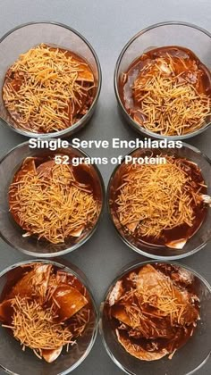 six bowls filled with food sitting on top of a gray counter next to each other