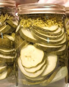 pickled vegetables in jars with herbs and seasoning on them are ready to be cooked