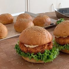 chicken sandwich with lettuce and mayonnaise on buns ready to go in the oven