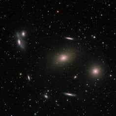 an image of many different objects in the dark night sky with stars and bright lights