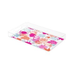 an acrylic tray with colorful paint splattered on it