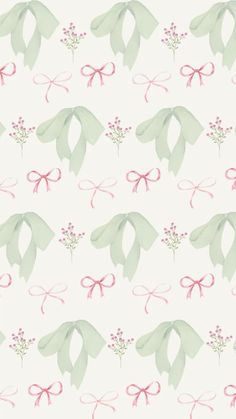 a white background with pink and green bows on it's sides, as well as flowers