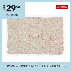 a white rug with the words home weavers inc belflower quick $ 29 99