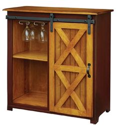 a wooden cabinet with two wine glasses on the door and one glass holder in front