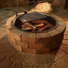 an outdoor bbq grill with tongs and food cooking on the outside fire pit