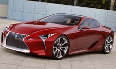 a red sports car parked in front of a building