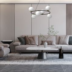 a living room filled with furniture and a chandelier hanging over the top of it