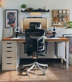 an office with a desk, chair and shelves on the wall above it is shown