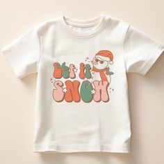 Let It Snow Snowman Christmas Toddler T-Shirt - Cute Winter Holiday Shirt - Retro Christmas Tee for Holiday Shirt Let It Snow Tee Experience ultimate comfort with our high-quality, super-soft shirts! ✨ Crafted using top-tier vinyl and pressed with a professional-grade heat press for a premium touch. Before placing your order, check out our color and size charts. Since each shirt is custom-made to your specifications, returns or exchanges are only accepted for order issues. 🎨📐 We collaborate with various shirt brands based on color and size availability. Our shirts focus on a soft style, not heavy cotton. Solid colors are 100% cotton, while heather colors are a  cozy cotton/poly blend (with a few exceptions). 😊👕 Our Sweatshirt: 70% SoftLume combed and ring-spun cotton, 30% polyester fle Let It Snow Kids Shirt, Let It Snow Tshirts, Let It Snow Snowman, Christmas Toddler, Toddler Christmas, Holiday Shirt, Snowman Christmas, Christmas Tees, Holiday Shirts