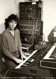 a man sitting in front of an electronic keyboard