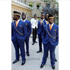 several men in blue suits and orange ties