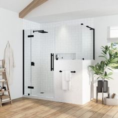 a bathroom with white walls and wooden floors