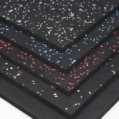 four pieces of black paper with multicolored confetti sprinkles