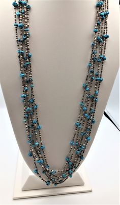 This piece is a MUSEUM quality example of a 6 strand TURQUOISE and HEISHI NECKLACE! The entire NECKLACE is really fine! The TURQUOISE is interspersed with brown and white pinshell HEISHI segments. It is about 32" long, with uniformly colored, rich TURQUOISE nuggets. Purchased by a MUSEUM curator in Flagstaff, AZ This NECKLACE was crafted in the 60's perhaps and weighs 58.45 grams. The closure is two cones with a hook n' eye. The cones are stamped and the NECKLACE is strung on old braided cord. This quality piece probably should be in a MUSEUM, but YOU can have it NOW! Buy from us! RETURN CUSTOMERS are welcome!    We want you to be happy and satisfied with your shopping experience today.  Most of what we offer has been collected over the years by us or friends.  We are 'downsizing' (age rel Cheap Blue Turquoise Southwestern Necklace, Affordable Turquoise Long Beaded Necklace, Turquoise Necklace With Single Strand Heishi Beads, Southwestern Beaded Turquoise Heishi Beads Necklace, Southwestern Style Hand-strung Heishi Beads Necklace, Western-style Hand-strung Turquoise Necklace, Blue Southwestern Hand-strung Necklaces, Boho Jewelry Diy, Heishi Necklace