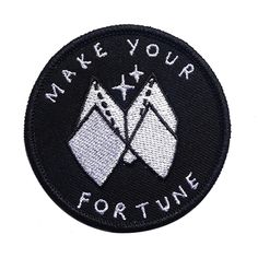 a black and white patch that says make your fortune