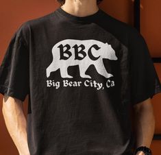 Big Bear City California, the original Big Bear California! The unisex Gildan 5000 heavy cotton tee is the basic staple of any wardrobe. It is the foundation upon which casual fashion grows. The specially spun fibers provide a smooth surface for premium printing vividity and sharpness. No side seams mean there are no itchy interruptions under the arms. The shoulders have tape for improved durability. We do not normally accept refunds, exchanges or cancelations, however, if you have a serious iss Big Bear California, Big Bear Lake, Bear Lake, Big Bear, Bear T Shirt, Negative Feedback, Bbc, Heavy Cotton, San Jose