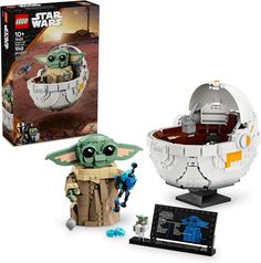 the lego star wars yoda's egg box is shown next to an action figure