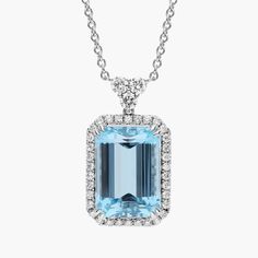 Catch their eye when you wear this gorgeous pendant set with a stunning emerald cut aquamarine stone featuring an alluring soft blue hue.  Surrounded by a halo of glistening diamonds, this pendant is a true showstopper. Elegant Octagon Aquamarine Jewelry, Elegant Gia Certified Blue Topaz Jewelry, Elegant Gia-certified Blue Topaz Jewelry, Luxury Blue Topaz Radiant Cut Jewelry, Luxury Blue Topaz Jewelry Radiant Cut, Luxury Radiant Cut Blue Topaz Jewelry, Elegant Gia Certified Aquamarine Jewelry, Light Blue Emerald-cut Gemstone Jewelry, Light Blue Emerald Cut Gemstone Jewelry