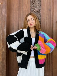 Trendy Black Color Block Cardigan, Winter White Color Block Cardigan, White Knit Color Block Cardigan, White Knit Cardigan With Color Block, Knitted Acrylic Cardigan For Cold Weather, Multicolor Knitted Outerwear For Layering, Casual Colorful Knitted Cardigan, Colorful Casual Color Block Cardigan, Casual Colorful Color Block Cardigan