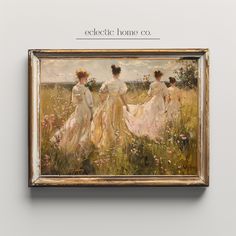 three women walking through a field in front of a white wall with the words eclectic home co on it