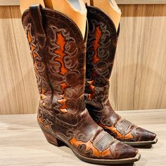 Women's Ariat 10007964 Dandy Cowgirl Boot Size 7.5 Width B Medium. Pre-Owned Very Good Condition. Comes With Ariat Cardboard Inserts. Purchased For $225.00 Plus Tax. Comes From A Pet-Free And Smoke-Free Home. Please Review All Photos Of Listing. Color: Sassy Brown/Sand Hill Brown Shaft Height : 12" Technology : Ats Toe: X Outsole Composition : Rubber Fashion Forward X-Toe With A Full Shaft And Vamp Underlay. This Fashion Boot Stands Out. Four-Row Stitch Pattern Full-Grain Leather 2.5" Rough Out Leather-Wrapped Heel Ats Footbed Provides Superior Stability And Cushioning. Duratread Outsole Provides Maximum Wear Resistance With Flexibility Orange Cowgirl Boots, Brown Sand, Boot Stand, Cowgirl Boot, Brown Orange, Cowgirl Boots, Dandy, Shoes Heels Boots, Full Grain Leather