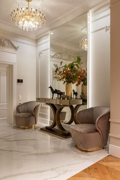 an elegant dining room with marble floors and chandelier