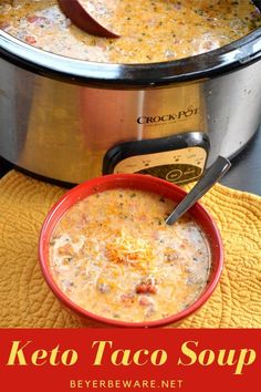 a red bowl filled with soup sitting on top of a yellow towel next to an electric pressure cooker