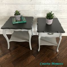 two small tables with plants on top of them