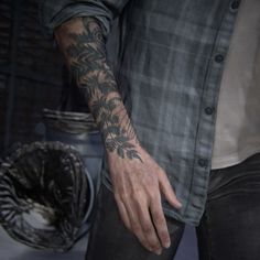 a man with a tattoo on his arm