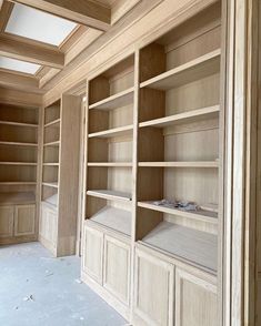 an empty room with wooden shelves in it