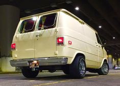 a white van parked in a parking garage