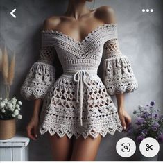 a crocheted dress with bell sleeves is featured on the instagram page, which features an image of a woman's torso