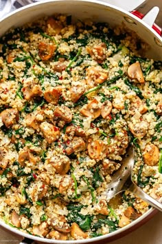 a large pot filled with rice and vegetables