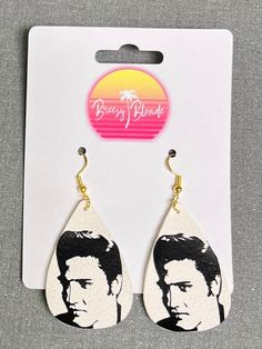 Where are my Elvis fans! If you are looking for some fun and flashy Elvis earrings, you've come to the right place.  All of my earrings are made with nickel free, 925 silver-plated copper earring hooks and they come with silicone safety backs stoppers.  They are handmade with faux leather and vinyl.  The double layer earrings will have plain white faux leather on top and the back layer can be red, gold, silver, green, or blue glitter.  Check out my shop for other Elvis earring designs. Message m Elvis Earrings, Layer Earrings, Earring Designs, Green Glitter, Earring Hooks, Red Glitter, Blue Glitter, Copper Earrings, Plain White