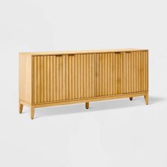 the sideboard is made out of wood and has three doors on one side, two drawers on the other