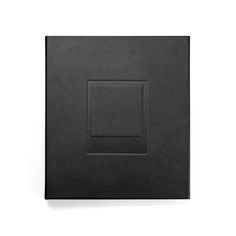 a black book with a square in the middle on a white background, front view