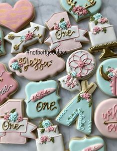 decorated cookies are arranged on a white plate